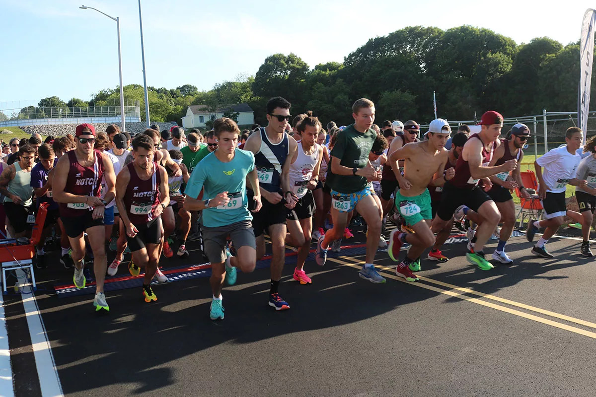Fiesta 5K Cape Ann YMCA YMCA runners sprint away from the starting line at the Cape Ann YMCA 5K