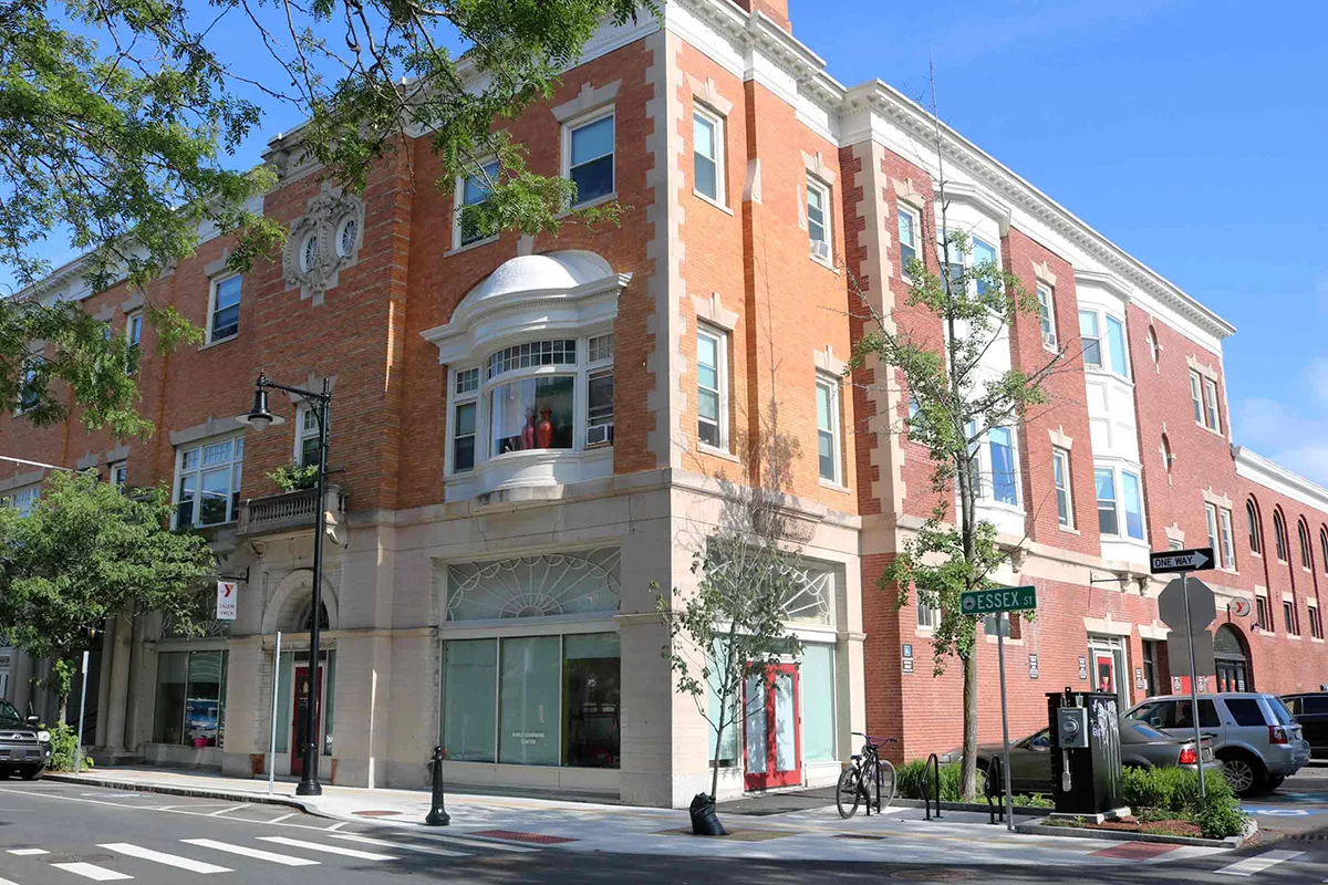 An exterior image of the Salem YMCA, location in the corner spot of a brownstone at the corner of Essex St.